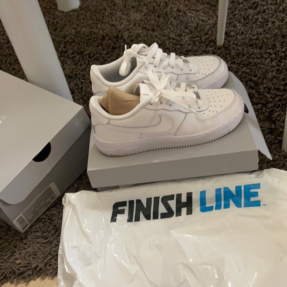 Two Air Force 1 pairs. Size 5 and 5.5 in youth size. 7.5 or 8 in women’s.